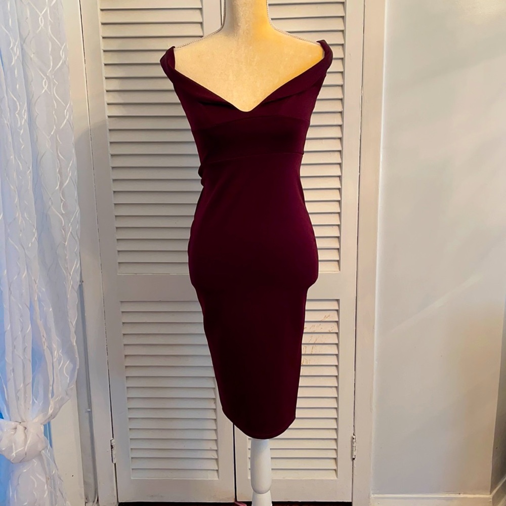 This is an over the shoulder burgundy dress
